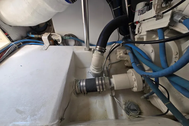  Yacht Photos Pics Engine room of 1986 Ocean Yachts 55 Super Sport with hoses and mechanical components.