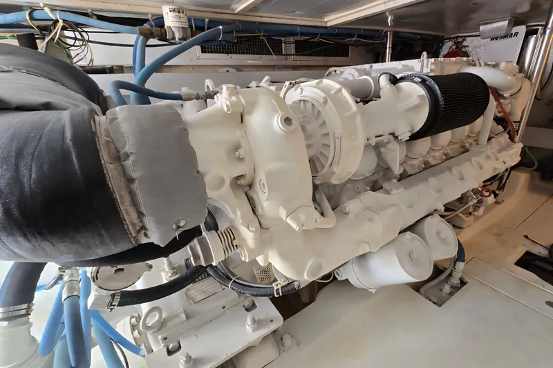  Yacht Photos Pics Engine room of 1986 Ocean Yachts 55 Super Sport, showcasing detailed machinery and components.