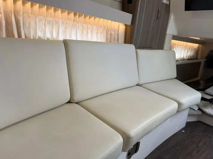  Yacht Photos Pics Luxurious interior seating of 2021 Regal 33 XO boat with elegant lighting.