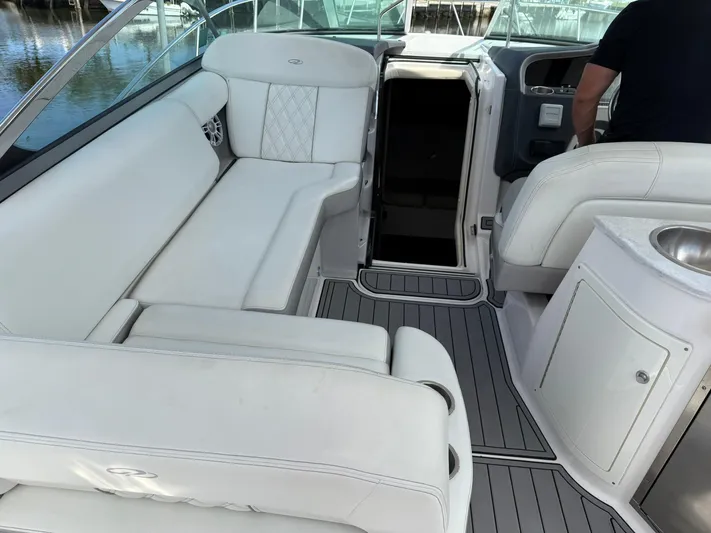  Yacht Photos Pics 2021 Regal 33 XO boat interior with white seating and modern design.