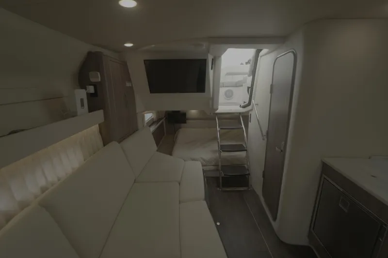  Yacht Photos Pics Interior of 2021 Regal 33 XO yacht with modern seating and entertainment area.