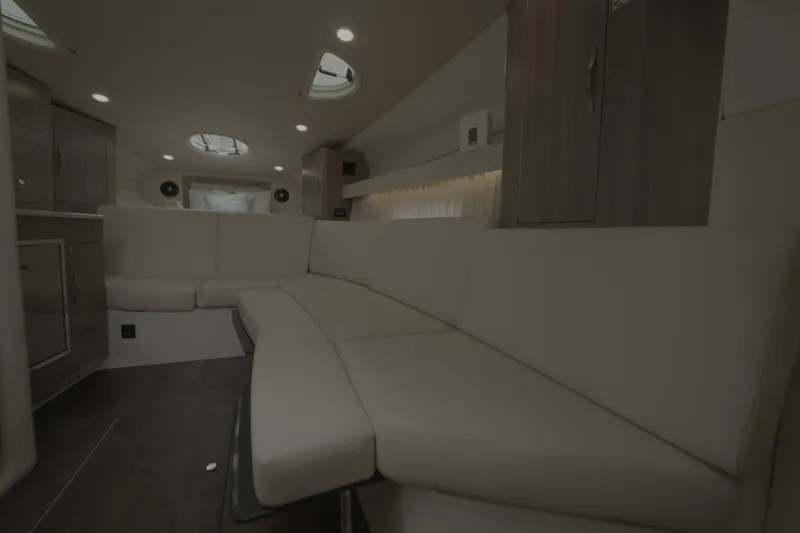  Yacht Photos Pics Luxurious interior of 2021 Regal 33 XO yacht with plush seating and modern design.