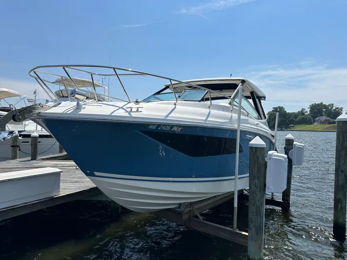  Yacht Photos Pics 2021 Sea Ray 320 Sundancer docked at marina, blue hull, sunny day.