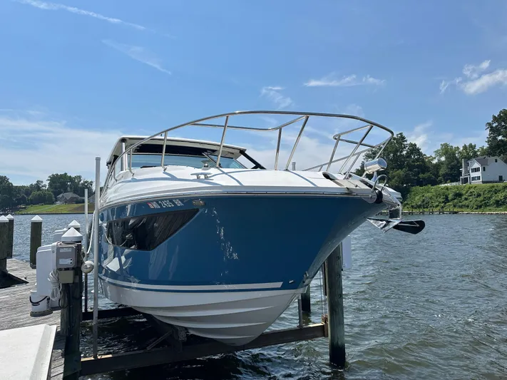  Yacht Photos Pics 2021 Sea Ray 320 Sundancer docked by the water on a sunny day.