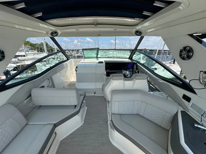  Yacht Photos Pics Interior of 2021 Sea Ray 320 Sundancer yacht with luxurious seating and modern helm.
