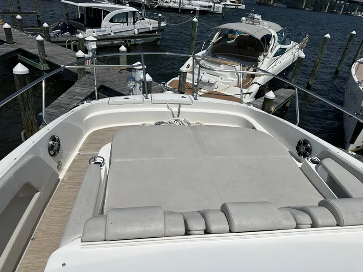  Yacht Photos Pics 2021 Sea Ray 320 Sundancer yacht docked at marina, featuring spacious sunbathing area.