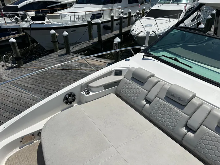  Yacht Photos Pics 2021 Sea Ray 320 Sundancer boat docked, featuring luxurious seating and sleek design.