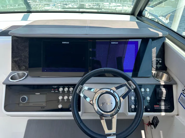  Yacht Photos Pics 2021 Sea Ray 320 Sundancer helm with Simrad displays and modern controls.