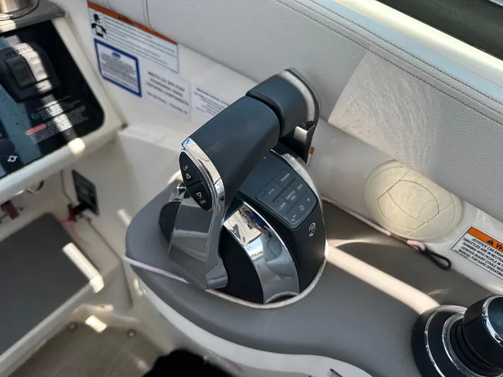  Yacht Photos Pics Throttle control of 2021 Sea Ray 320 Sundancer boat, featuring modern design and functionality.