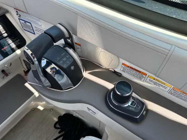  Yacht Photos Pics Control panel of a 2021 Sea Ray 320 Sundancer boat, featuring throttle and joystick controls.