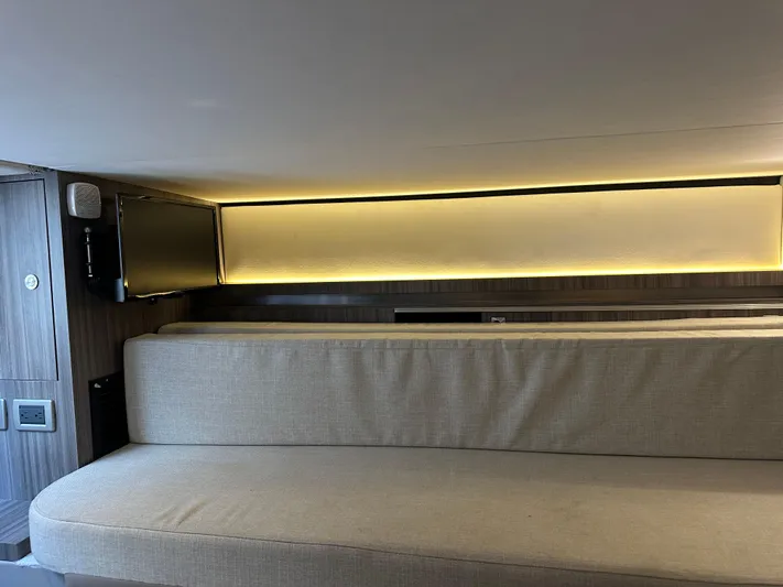  Yacht Photos Pics Interior of 2021 Sea Ray 320 Sundancer with beige seating and ambient lighting.