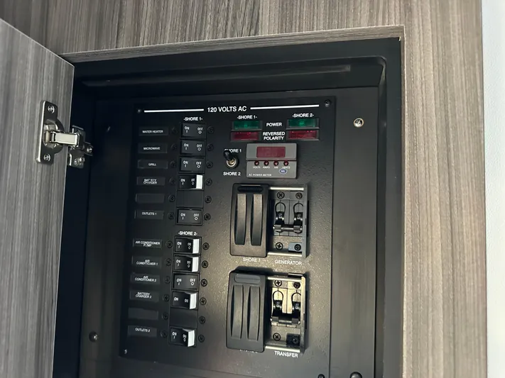  Yacht Photos Pics Electrical panel of 2021 Sea Ray 320 Sundancer boat, featuring various switches and controls.