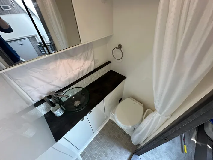  Yacht Photos Pics Modern bathroom interior of 2021 Sea Ray 320 Sundancer yacht, featuring sleek design and amenities.