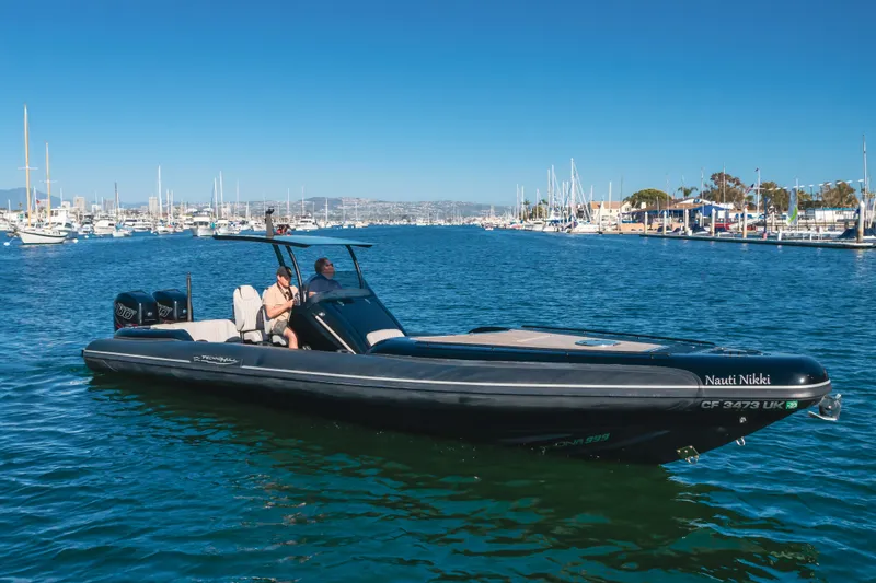  Yacht Photos Pics 2019 Technohull Sea DNA 999 boat cruising in a marina under clear blue skies.