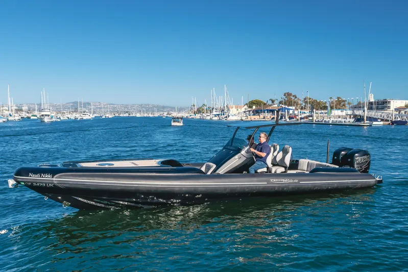  Yacht Photos Pics 2019 Technohull sea DNA 999 boat cruising in a marina under clear blue skies.
