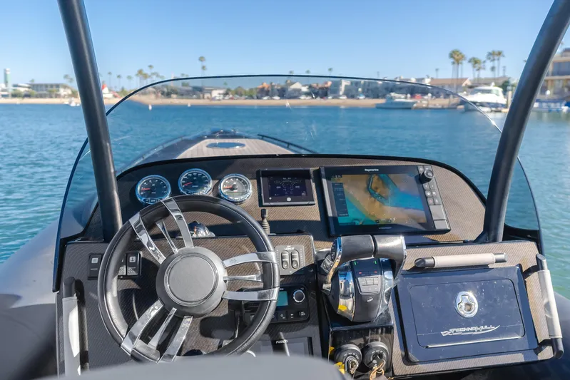  Yacht Photos Pics 2019 Technohull sea DNA 999 dashboard with navigation system and steering wheel on open water.