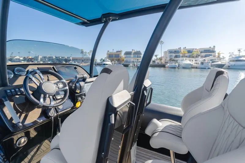  Yacht Photos Pics 2019 Technohull Sea DNA 999 cockpit with luxurious seating and marina view.