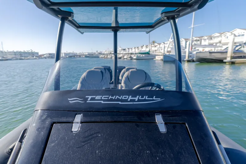  Yacht Photos Pics 2019 Technohull Sea DNA 999 boat docked in a marina, showcasing sleek design.