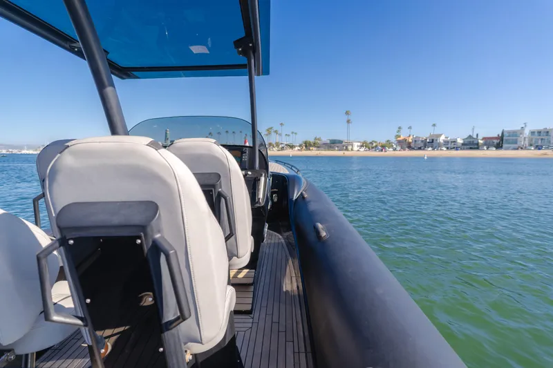  Yacht Photos Pics 2019 Technohull Sea DNA 999 boat interior with coastal view, featuring sleek seating and clear blue skies.