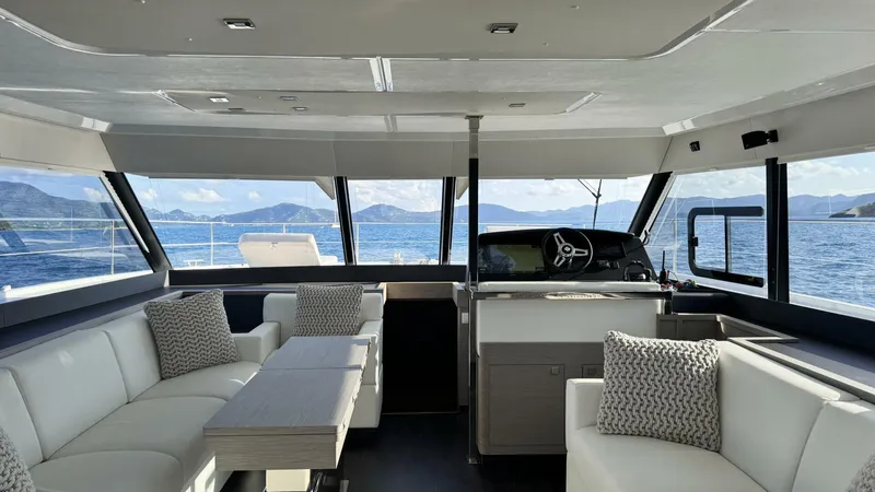 Pheonix Yacht Photos Pics Luxurious interior of 2022 Fountaine Pajot MY6 yacht with panoramic ocean views.