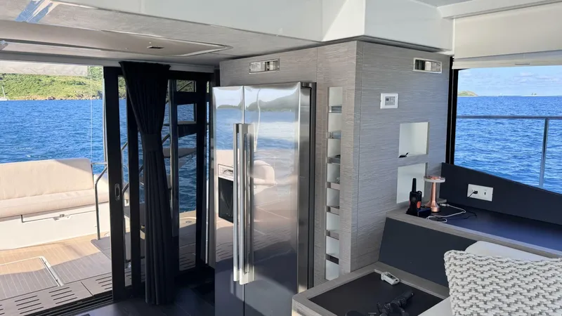 Pheonix Yacht Photos Pics Luxurious interior of 2022 Fountaine Pajot MY6 yacht with modern design and ocean view.