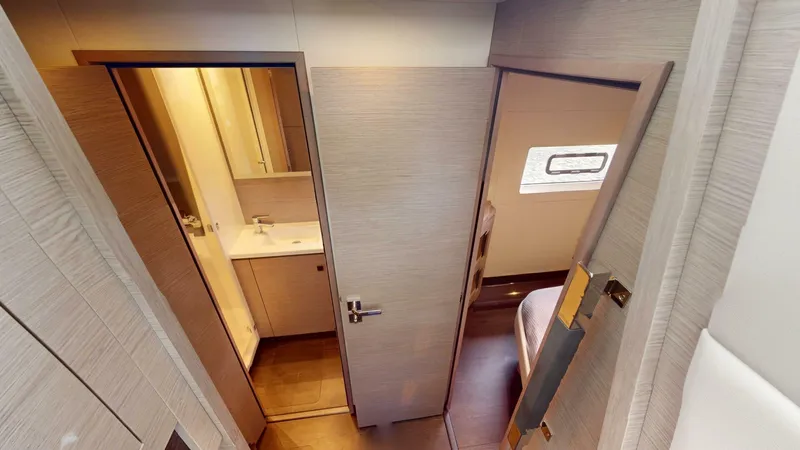 Pheonix Yacht Photos Pics Interior view of 2022 Fountaine Pajot MY6 yacht, featuring a bathroom and bedroom.