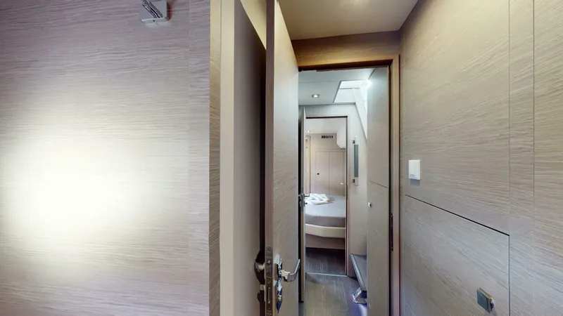 Pheonix Yacht Photos Pics Interior hallway of 2022 Fountaine Pajot MY6 yacht, featuring modern design and cozy lighting.