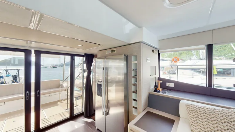 Pheonix Yacht Photos Pics Interior of 2022 Fountaine Pajot MY6 yacht with modern kitchen and seating area.