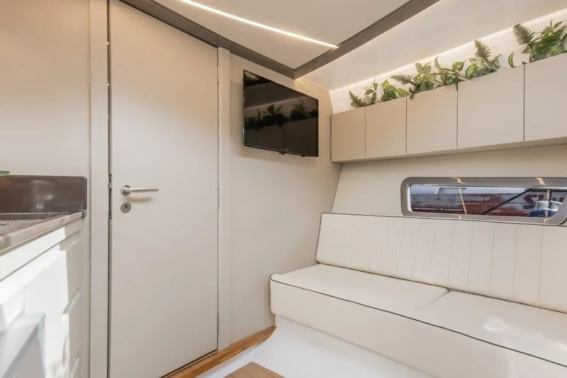  Yacht Photos Pics Modern interior of 2024 Hanover 415 Pure Gray yacht with sleek design and greenery accents.