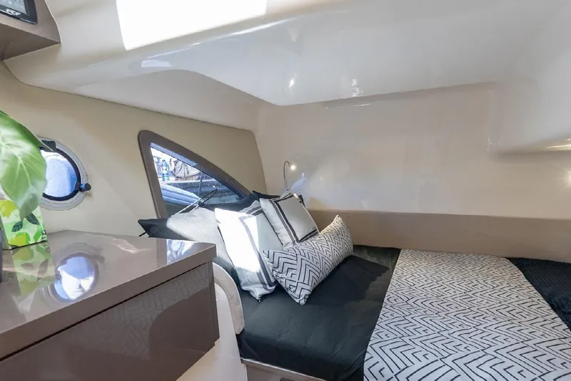  Yacht Photos Pics Luxurious interior cabin of 2024 Hanover 415 Pure Gray yacht, featuring modern bedding and decor.