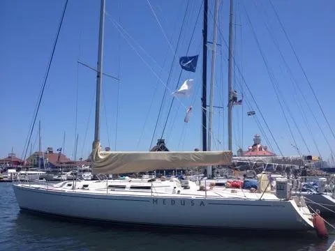 Medusa Yacht Photos Pics 1996 Santa Cruz 52 sailboat Medusa docked at marina on a sunny day.