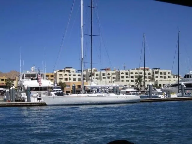Medusa Yacht Photos Pics 1996 Santa Cruz 52 sailboat docked at a marina with buildings in the background.