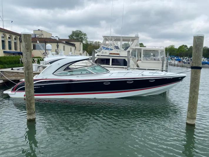 Formula 400 Ss Yacht Photos Pics 2013 Formula 400 Super Sport boat docked in a marina, overcast sky.