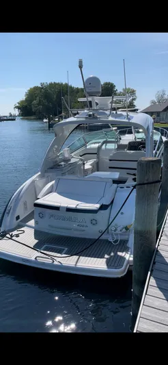 Formula 400 Ss Yacht Photos Pics 2013 Formula 400 Super Sport yacht docked by a serene waterfront.