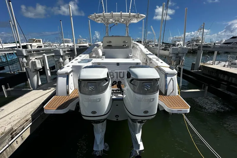  Yacht Photos Pics 2022 Southport 30 FE boat with dual Suzuki engines docked at marina.