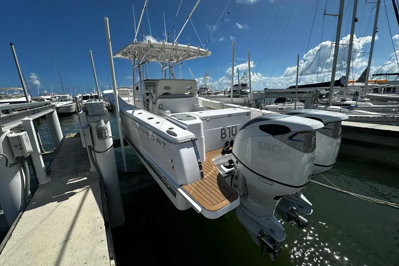  Yacht Photos Pics 2022 Southport 30 FE boat docked with dual Suzuki outboard engines.