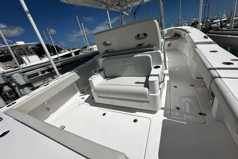  Yacht Photos Pics 2022 Southport 30 FE boat interior with seating and storage, docked at marina.