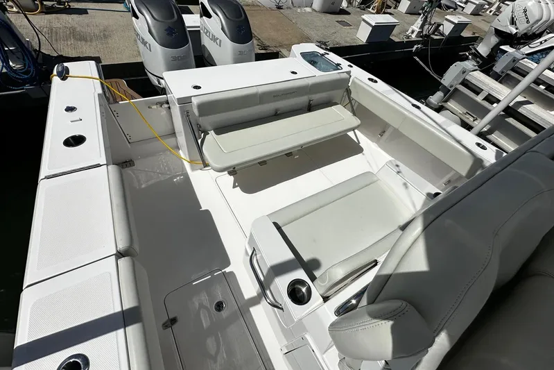  Yacht Photos Pics 2022 Southport 30 FE boat interior with seating and dual Suzuki outboard engines.