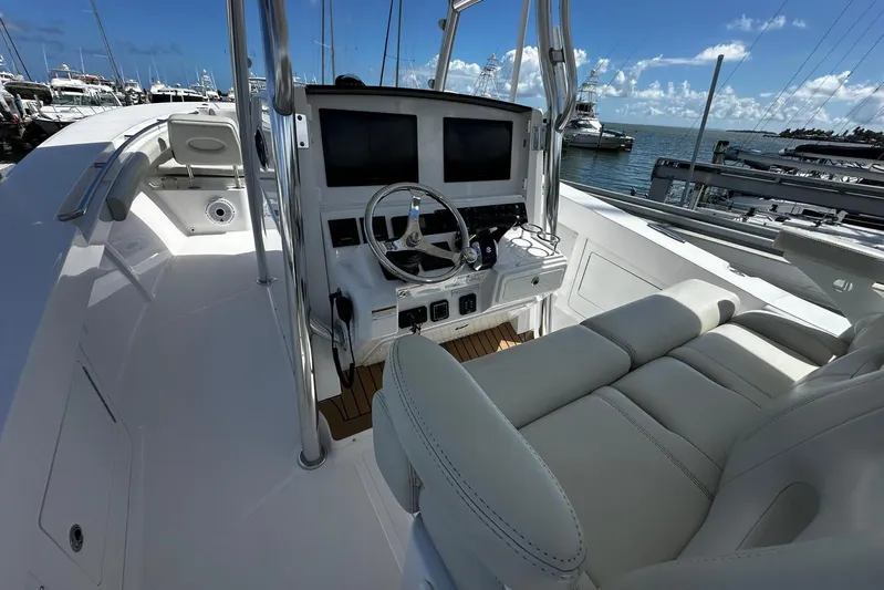  Yacht Photos Pics 2022 Southport 30 FE boat interior with helm, seating, and ocean view.