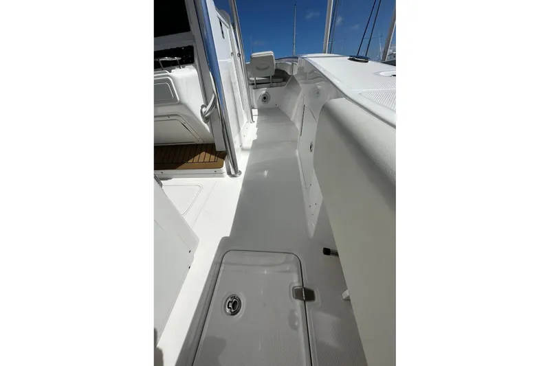  Yacht Photos Pics 2022 Southport 30 FE boat interior with sleek white deck and seating.