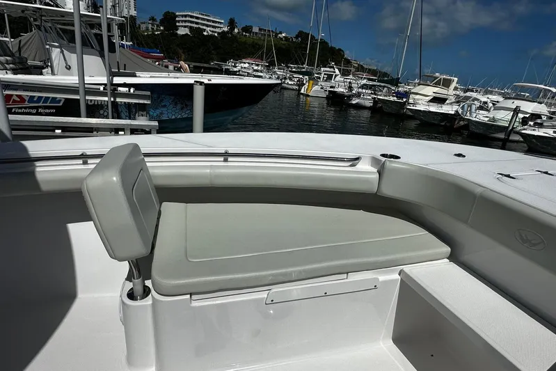  Yacht Photos Pics 2022 Southport 30 FE boat with cushioned seating at marina.