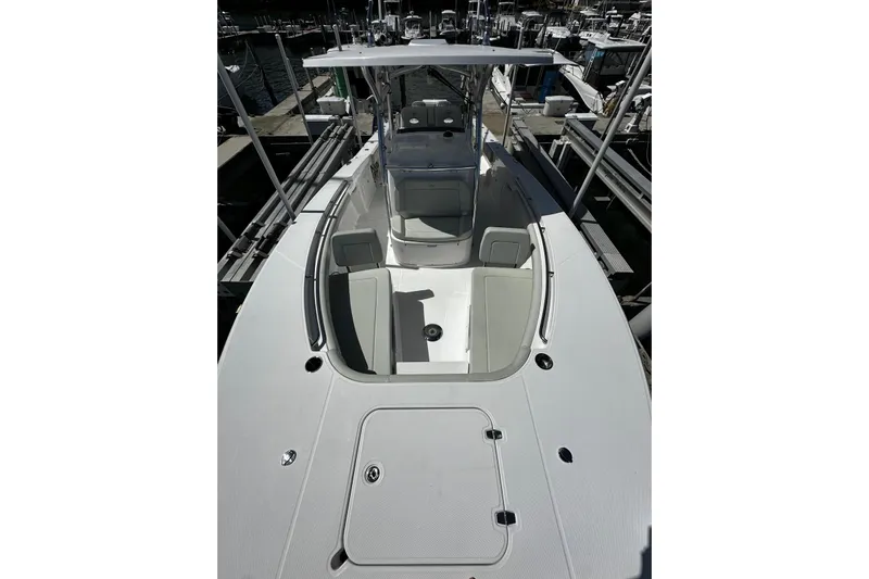  Yacht Photos Pics 2022 Southport 30 FE boat with spacious deck and seating, docked at marina.