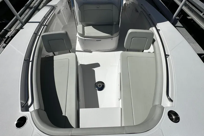  Yacht Photos Pics 2022 Southport 30 FE boat interior with cushioned seating and sleek design.