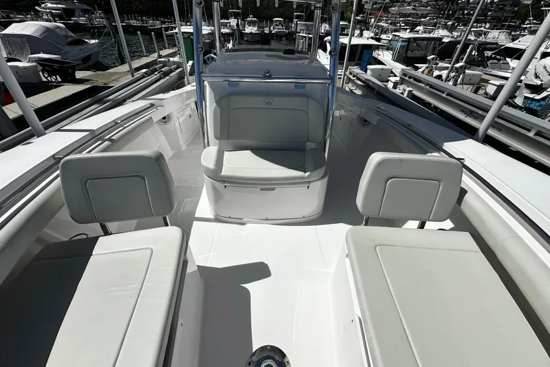  Yacht Photos Pics 2022 Southport 30 FE boat interior with white seating and marina background.