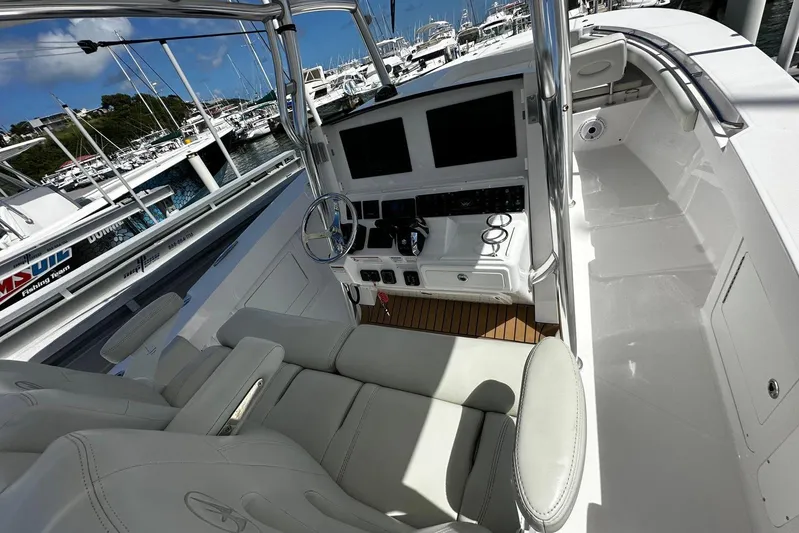  Yacht Photos Pics 2022 Southport 30 FE boat cockpit with modern controls and seating at marina.
