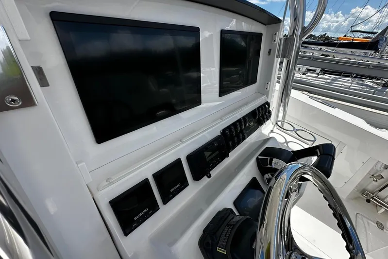  Yacht Photos Pics 2022 Southport 30 FE boat dashboard with multiple screens and controls.