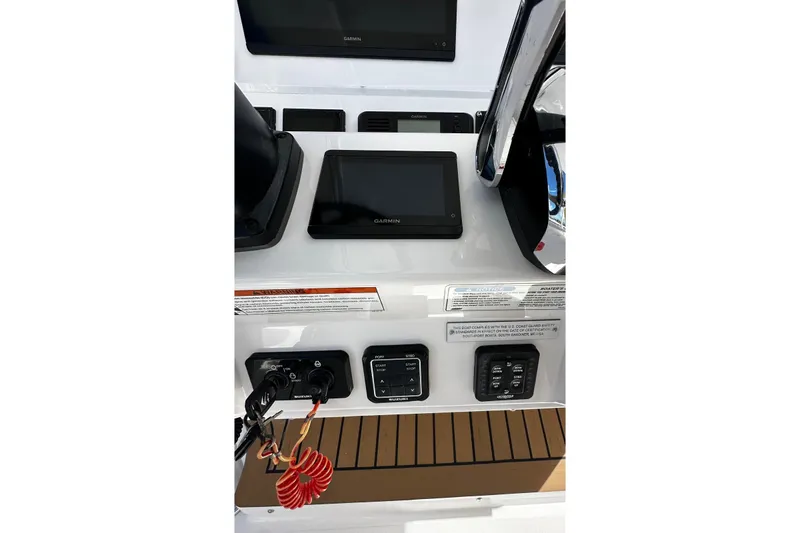  Yacht Photos Pics Control panel of 2022 Southport 30 FE boat with Garmin display and switches.