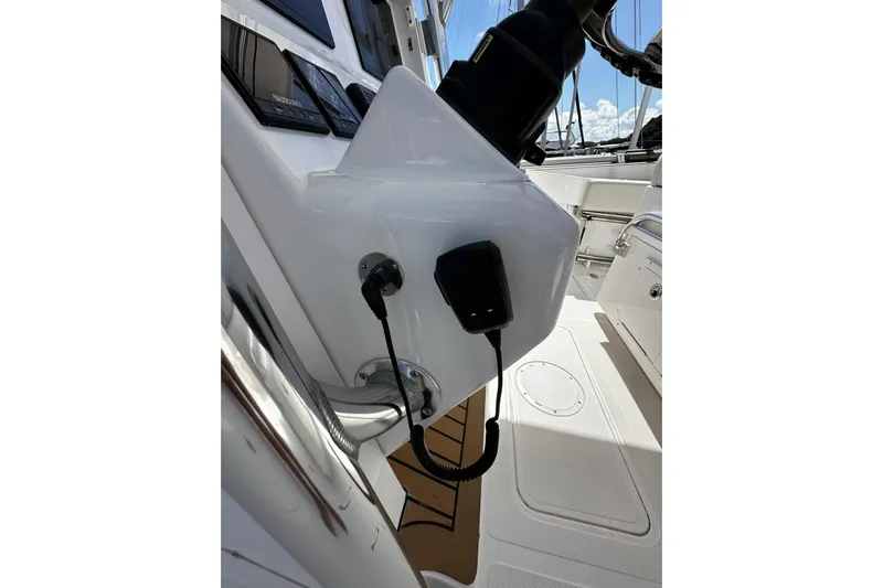  Yacht Photos Pics 2022 Southport 30 FE boat helm with control panel and microphone.