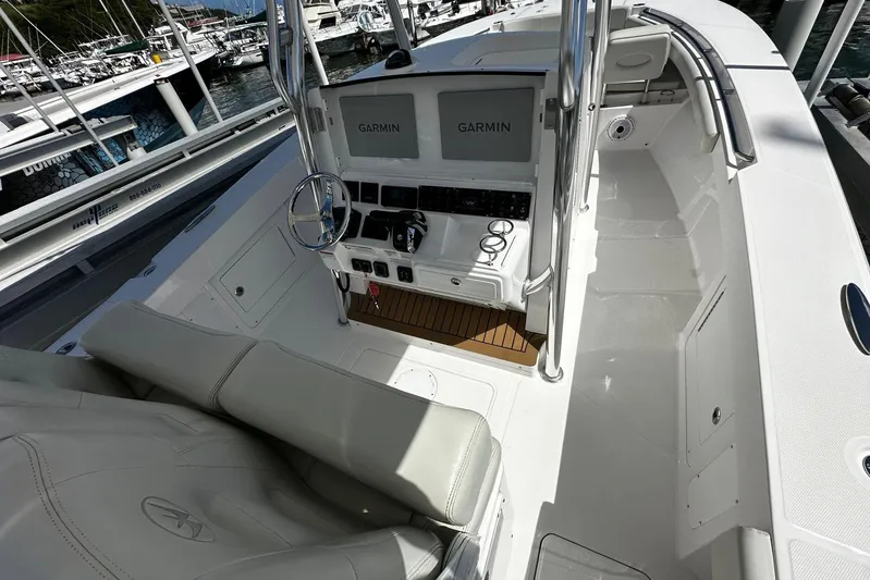  Yacht Photos Pics 2022 Southport 30 FE boat interior with Garmin navigation system at marina.