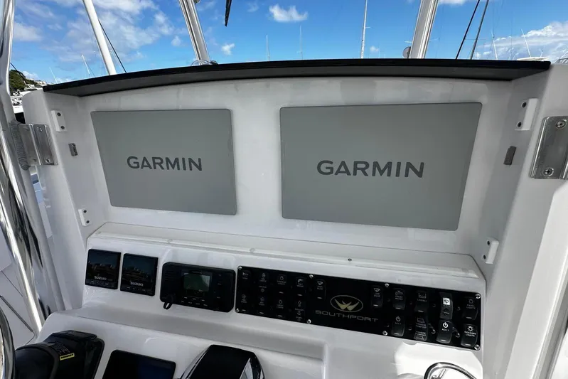 Yacht Photos Pics 2022 Southport 30 FE boat dashboard with dual Garmin displays and control panel.